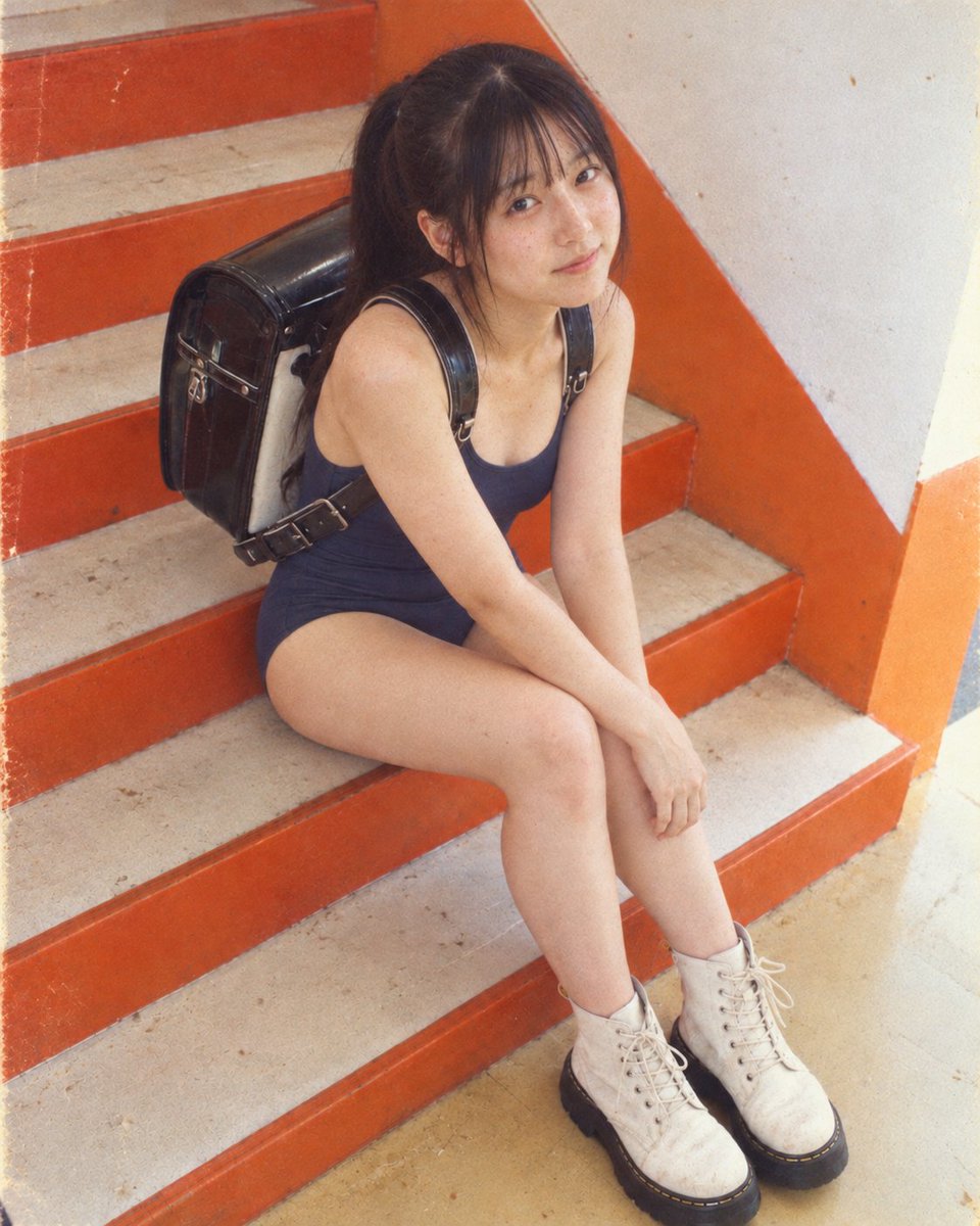 Social Media Post - Girl in Swimsuit on Orange Stairs - Image 1