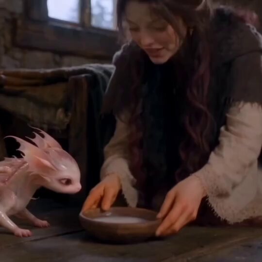 Cinematic Fantasy Video with Pink Dragon and Woman in Cabin